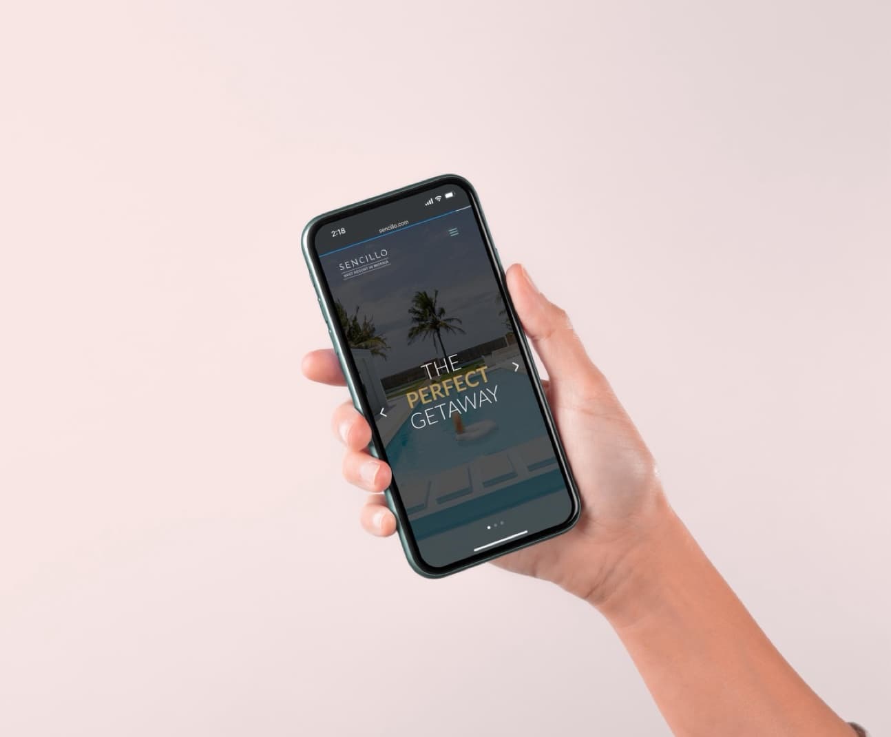 Sencillo website on a phone held in a hand