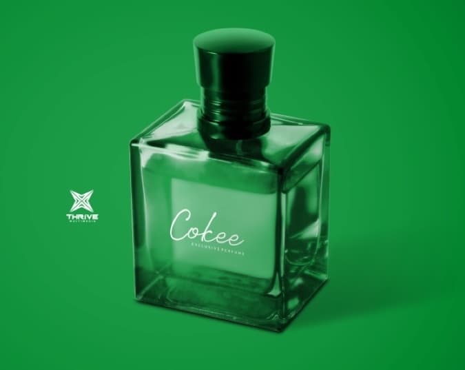 Cokee Exclusive Perfume bottle on a green background